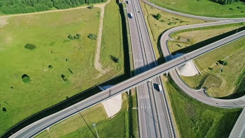 Transport Interchange on the Highway Aerial of Cars Drive Along the Highway Outside the City