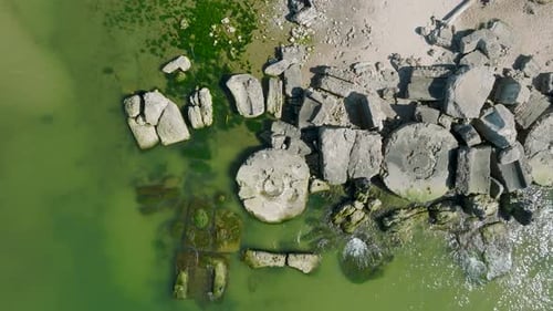 Beautiful aerial establishing view of Karosta (Liepaja) concrete coast fortification ruins, calm Bal