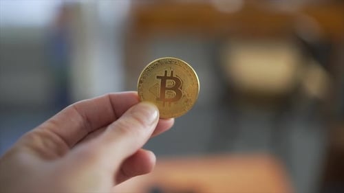 Bitcoin in Hand Currency Close Up