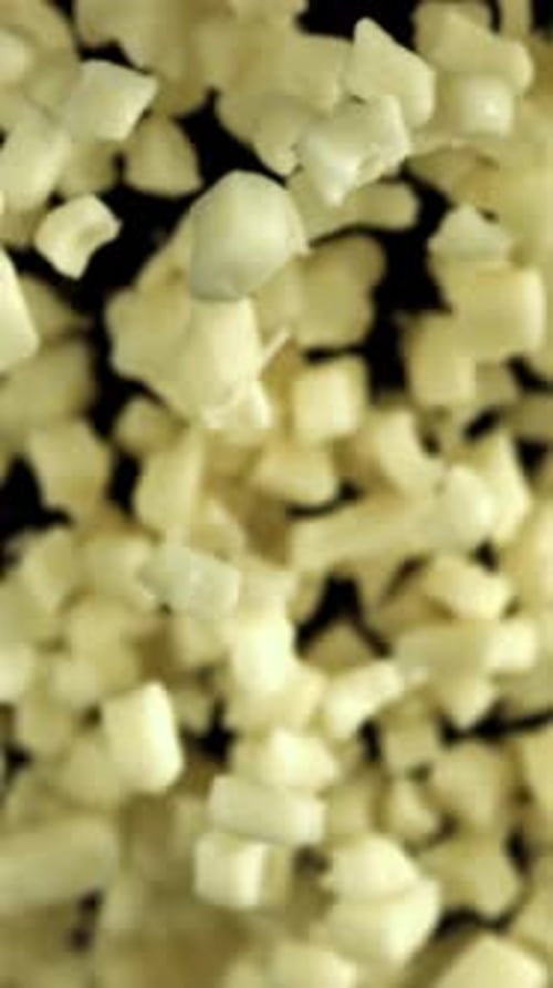 Mozzarella Cheese Flies Up and Falls Down on a Black Background Filmed on a Highspeed Camera at 1000