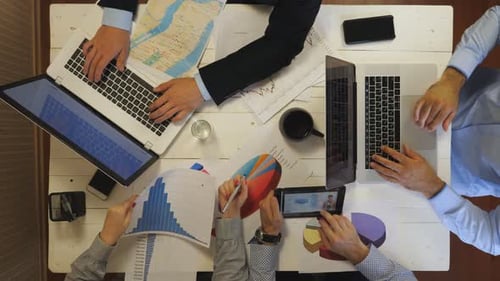 Group of Young Colleagues Work on Business Development Sitting at Table in Office Male and Female