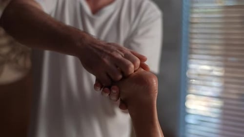 Man Giving Relaxing Foot Massage Close Up