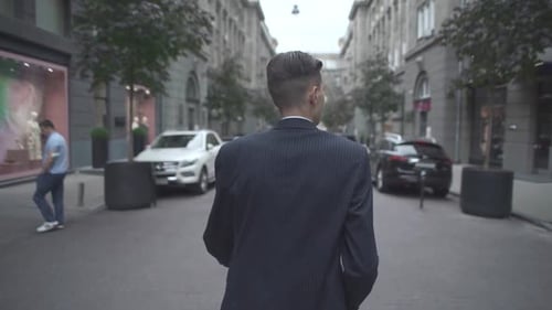 Stylish Man Walking in City Center Street