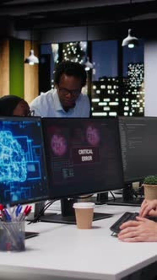 Vertical Video Software Developer in Office Receiving Critical Error Warning