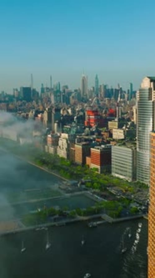 White thick smoke coming closer to the Manhattan Island. Amazing New York cityscape