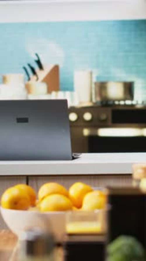 Kitchen Still Life: Fruit, Laptop, and Fresh Juice