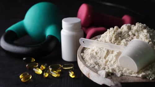 Exercise Weights and Supplements Close Up