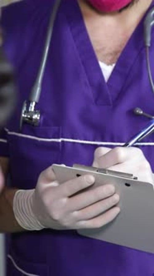 Medical Professional Writes on Clipboard as Dog Appears