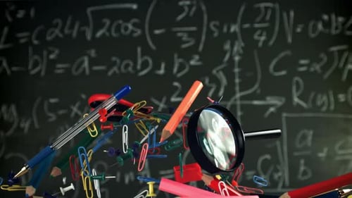 Different School Objects Fly and Fall Against the Background of the Blackboard Filmed on a Highspeed