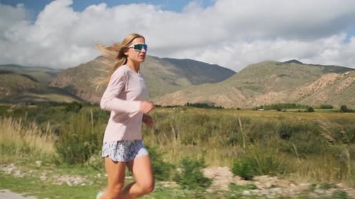 Professional Athlete Runs a Mountain Road Prepping for a Championship