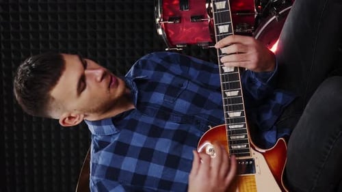 Guitarist playing on electric guitar