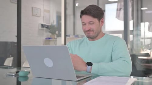 Man Talking During Video Conference at Work