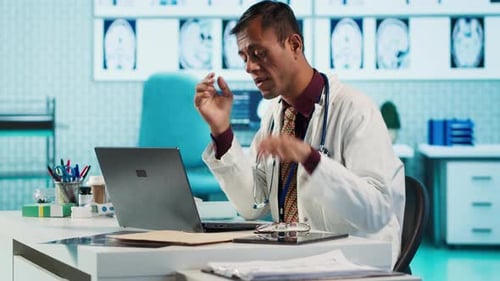 Stressed Doctor at His Desk
