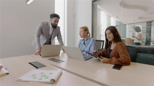 A Diverse Team Collaborates Well in a Modern Office That Encourages Innovation and Creativity