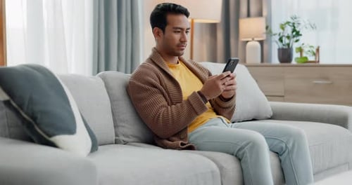 Home cellphone, relax and man typing communication, social network post or contact online user