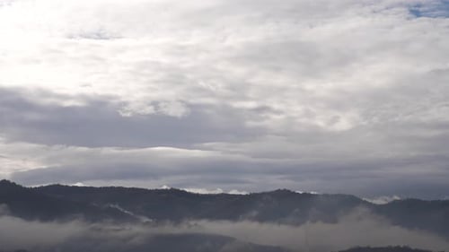 Misty mountain timelapse with moody dark clouds