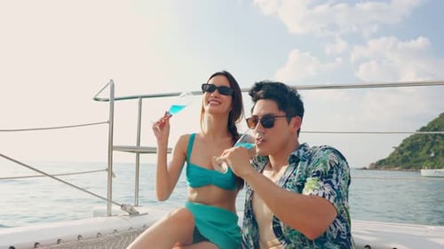 Couple Drinking on Boat During Summer Vacation