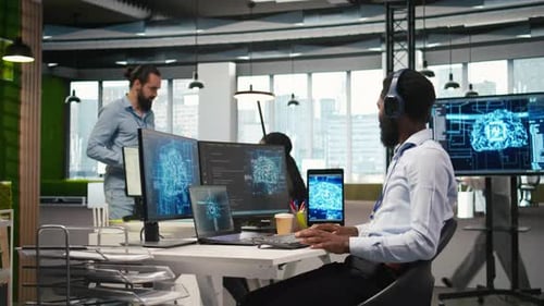 Programmer in Office Relies on AI Machine Learning to Automate Repetitive Tasks