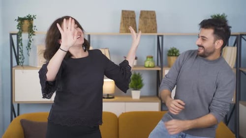 Couple Dancing Together Joyfully in a Home Setting