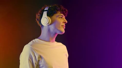 Young Adult Enjoys Music with Headphones