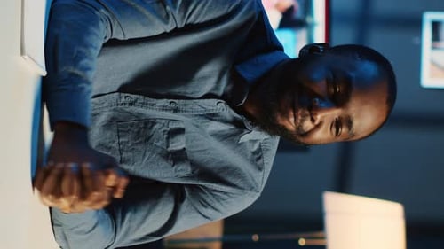 Man Gesturing in Office, Vertical Orientation