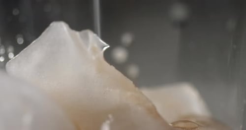 Pouring Soda Over Ice Close Up