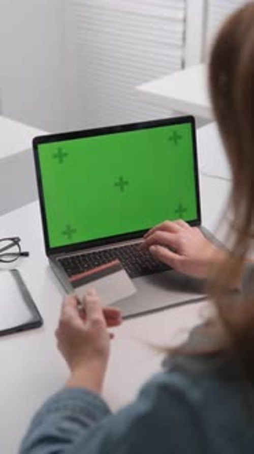 The Image Illustrates the Concept of Online Shopping Showing a Person Using a Credit Card on a