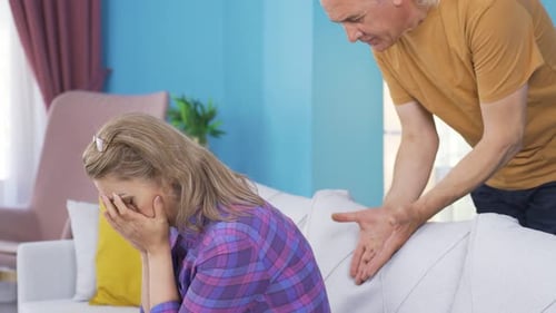 Woman Reacts to Arguing Man in Home Setting