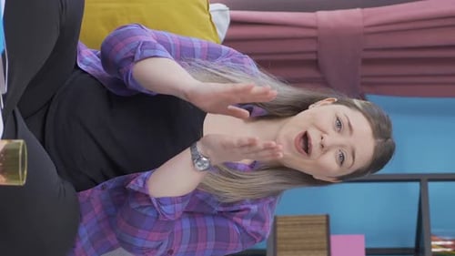 Woman Talking and Clapping in Blue Room