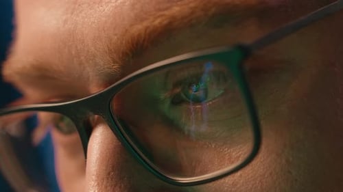 Man Wearing Glasses Reflecting Screen Close Up