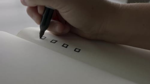 Marking Items Off Checklist in Office Setting