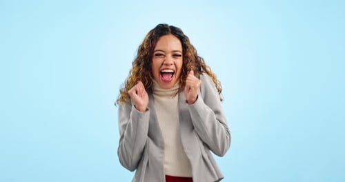 Face, dance and woman with celebration, business and promotion on a blue studio background
