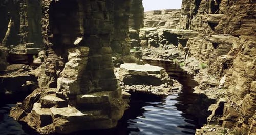 Unique Rock Formations and Tranquil Waters in a Remote Canyon Landscape
