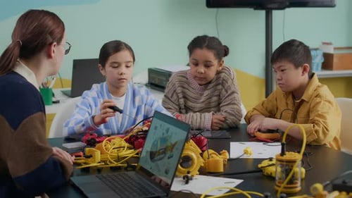 Children Learn Robotics with Teacher in Classroom