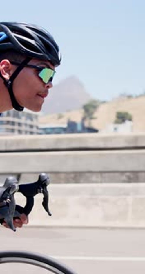 Athlete, man or cycling on bike in city for cardio workout, endurance challenge
