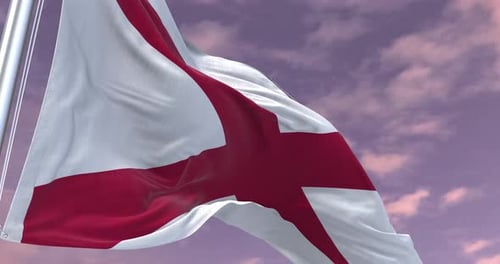 England Flag Waving in Slow Motion Against Cloudy Sky