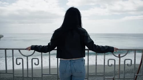 Woman Looking Out From the Balcony and Looking at the Sea