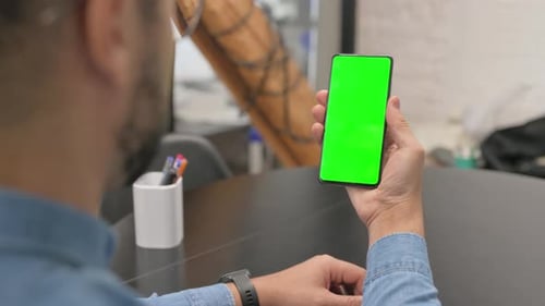Close up of African Man using Phone with Green Screen