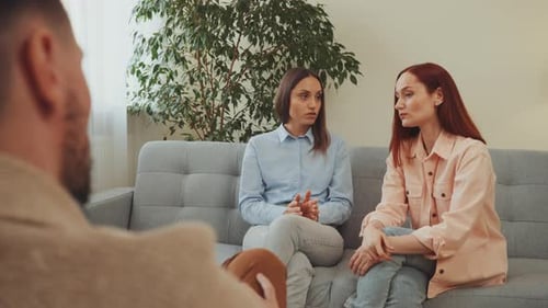 Women Talk to Therapist in Home Setting