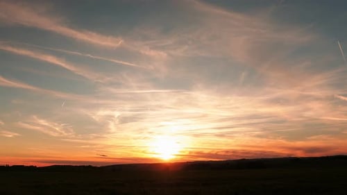 Sunrise Timelapse with Clouds and Vapor Trails