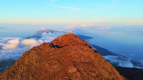Hiker Man on Top of Mount Pico at Sunset Pico Island Azores Portugal Aerial View