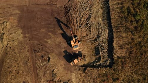 Top View of Two Excavators Doing Earthwork at Construction Site
