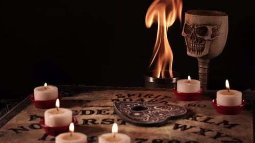 Eerie Candles and Spirit Board with Skull