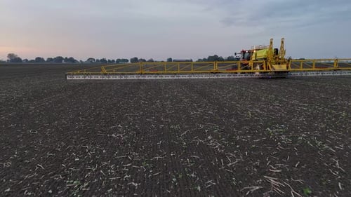 Tractor Spraying On Field With Sprayer, Herbicides And Pesticides