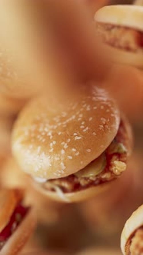 Animation of a group of burgers. Defocus. Close-up.