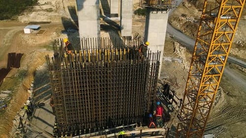 Construction Workers Working With Iron