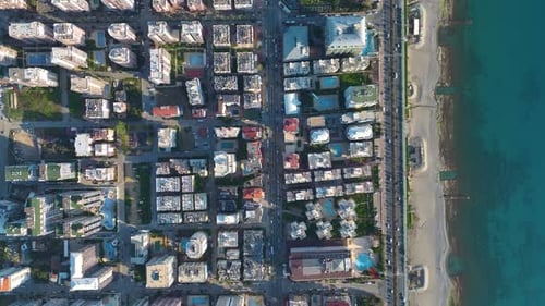 Aerial Video of Seaside City Blocks and Parallel Beachfront Roads
