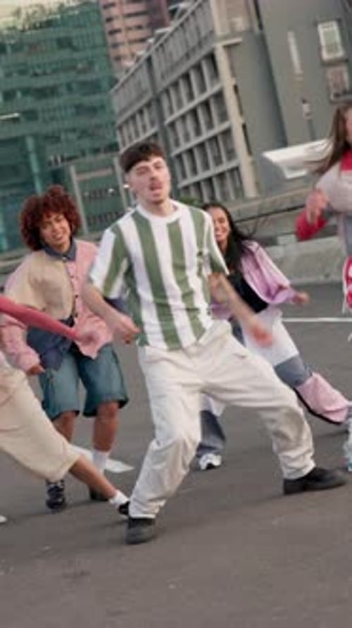 Urban, dancing and group of people in city for creative rhythm, performance and hip hope routine