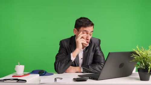 Professional Man Working at Desk on Computer