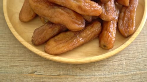 Close up of glazed bananas on wooden table